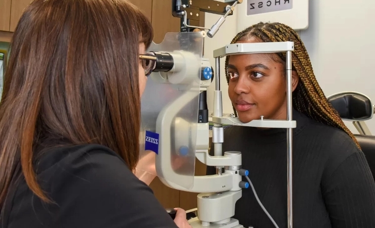 Woman receiving urgent eye care exam